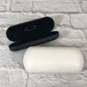 Oakley Sunglasses cases. Set of 2. White large. Black small. Preowned